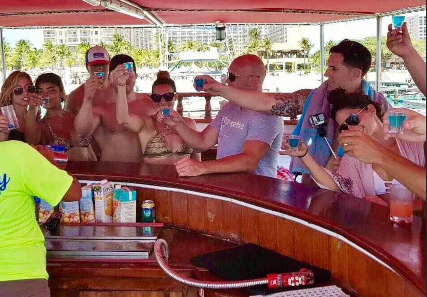 Guests toasting with drinks aboard the schooner