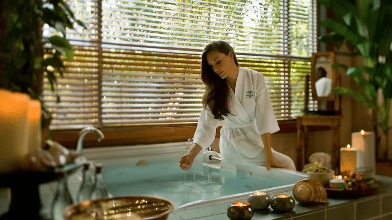 A woman relaxing in a spa robe in Aruba