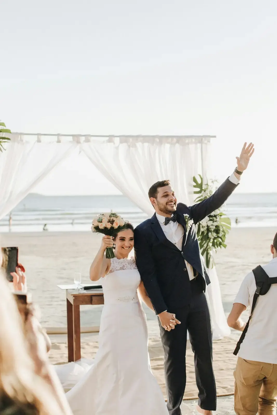 A newlywed couple standing together on an Aruba beach