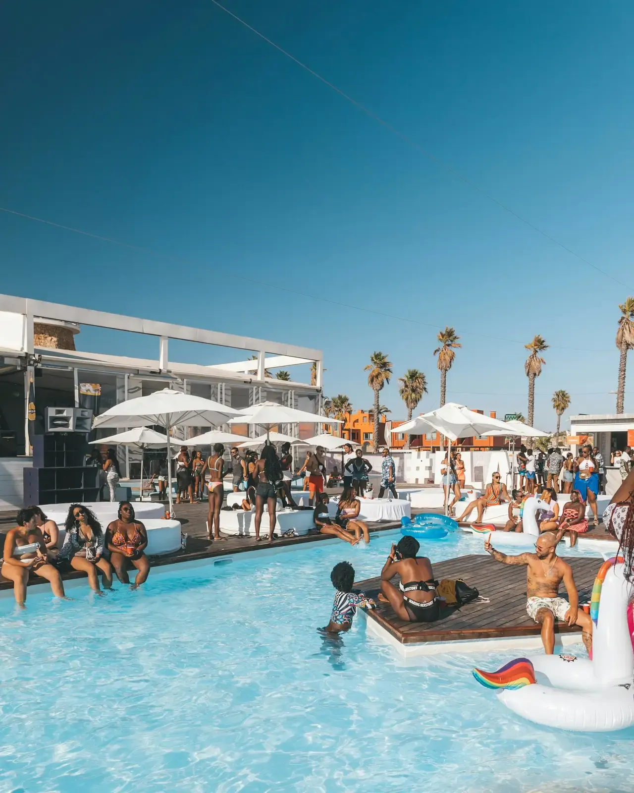 A guest floats in a resort pool