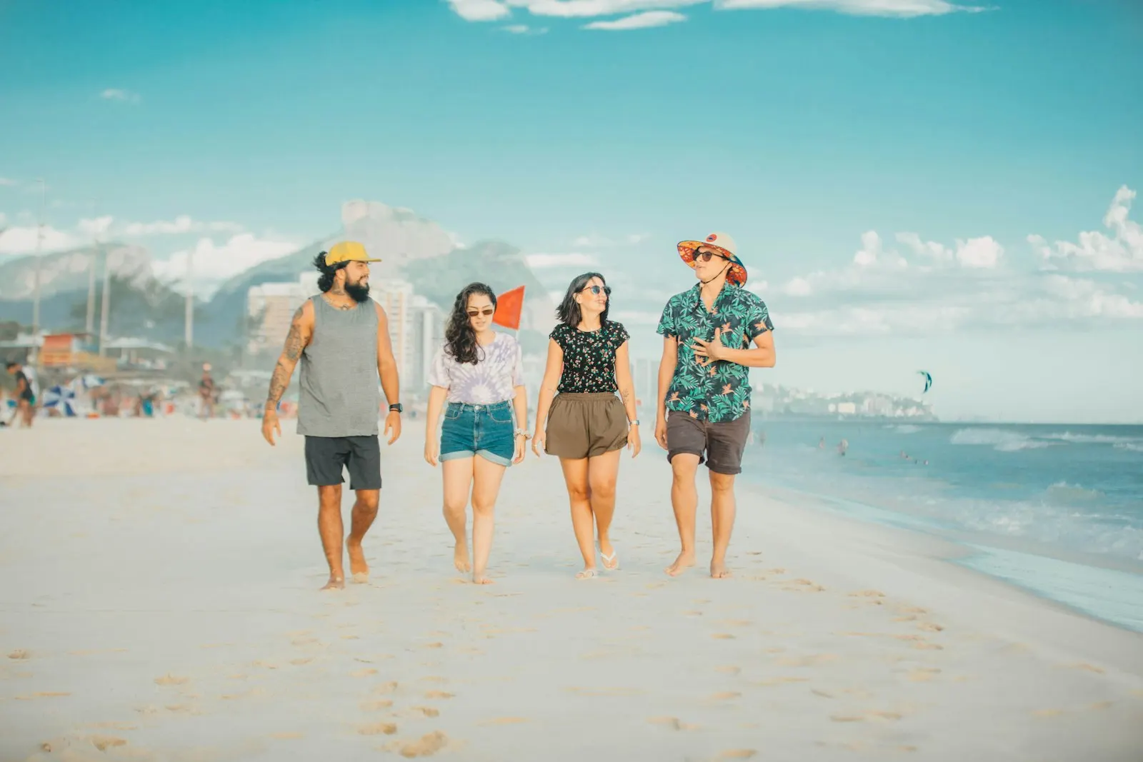 Three women standing together on an Aruba beach